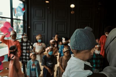 1 year old boy celebrating birthday with his friends