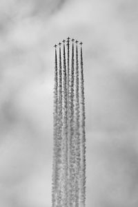 Low angle view of airplane flying against sky