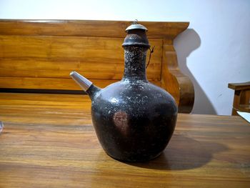 Close-up of bottle on table at home