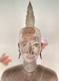 Old buddha statue staring at you with wisdom and beauty