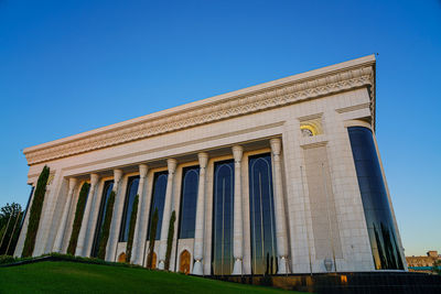 Low angle view of building against clear blue sky