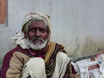 Portrait of man sitting outdoors