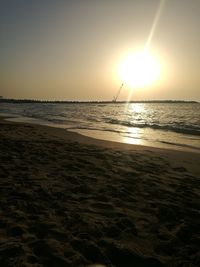 Scenic view of sea against clear sky during sunset