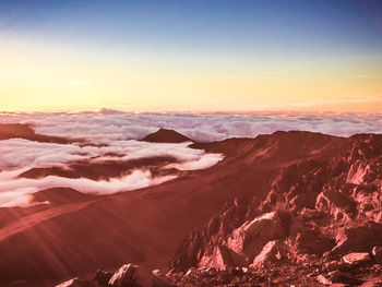 Scenic view of dramatic landscape during sunset