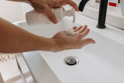 High angle view of baby feet in bathroom