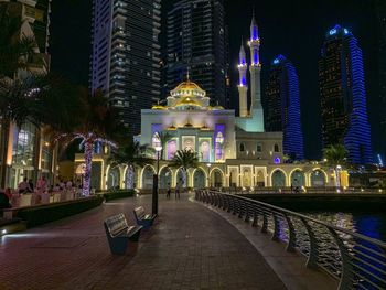 Illuminated buildings in city at night
