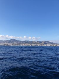 Scenic view of sea against blue sky