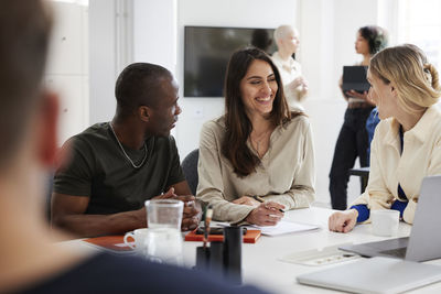 Group of business people discussing project in office