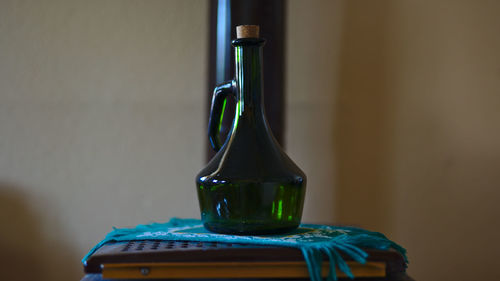 Close-up of wine bottles on table