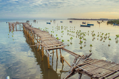 Pier over sea against sky
