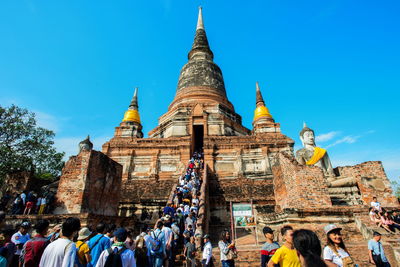 Group of people in temple against building