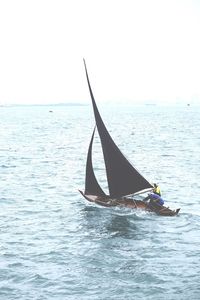 Boat sailing in sea