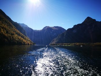 Scenic view of lake and mountains against sky