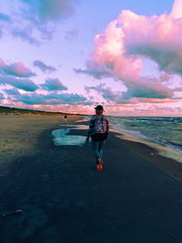 Man on beach against sky