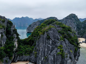 Panoramic view of sea and mountains against sky