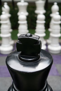 Close-up of chess pieces on table