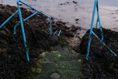 High angle view of rope tied on sandy beach