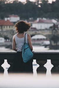 Rear view of woman looking at view of buildings