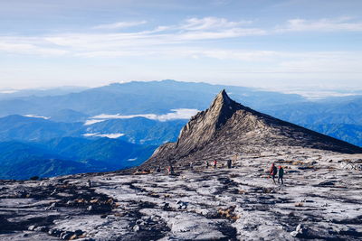 People on mt kinabalu against sky