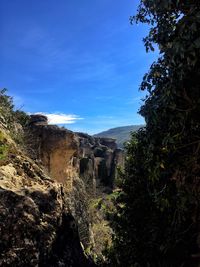 Scenic view of landscape against blue sky