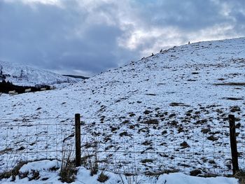 Scenic view of snow covered mountain against sky