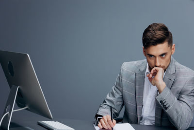 Thoughtful businessman sitting office