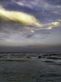 Scenic view of sea against sky at sunset