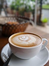 Close-up of cappuccino on table