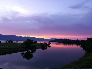 Scenic view of lake against sky during sunset