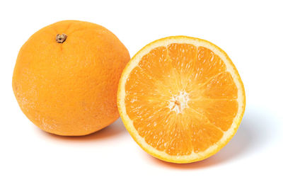 Close-up of orange slice against white background