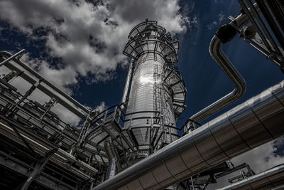 Natural gas plant structures against dark blue sky