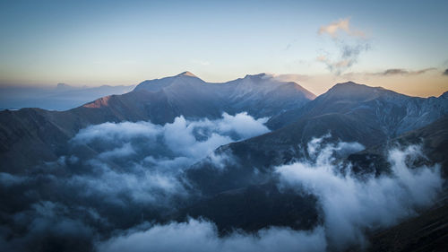 Scenic view of mountains against sky during sunset