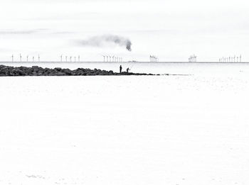 Scenic view of land against sky during winter