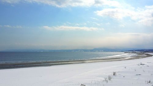 Scenic view of beach against sky