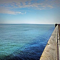 Scenic view of sea against blue sky