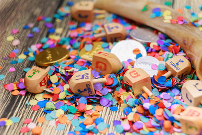 Close-up of confetti and dreidel