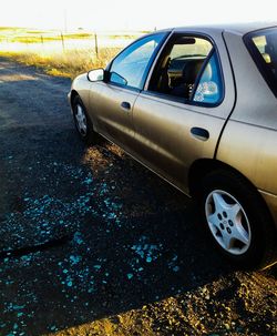 Cropped image of car on road