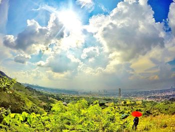 Scenic view of landscape against cloudy sky