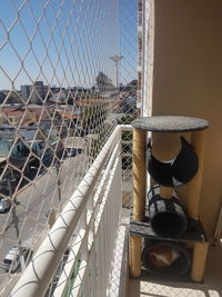 Cityscape seen through chainlink fence