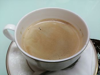 High angle view of coffee cup on table