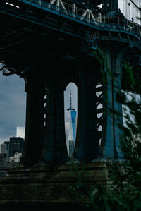 Low angle view of bridge in city