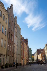 Street amidst buildings against sky