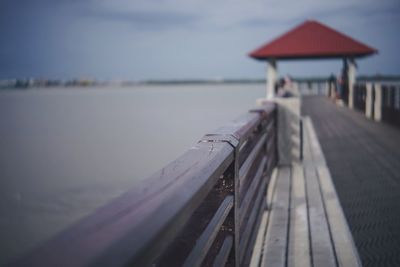 Pier over sea against sky