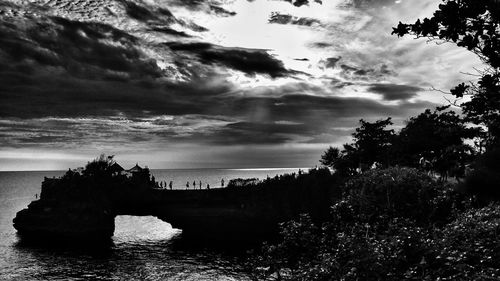 Scenic view of sea against cloudy sky