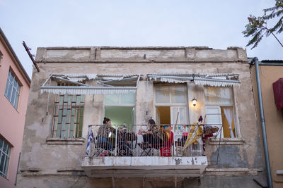 Low angle view of people outside building