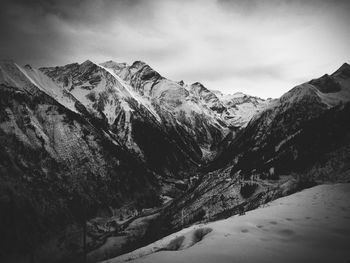 High angle view of rocky landscape against clouds