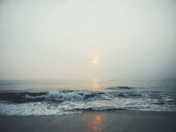 Scenic view of sea at sunset