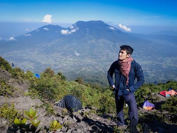 Full length of man standing on mountain