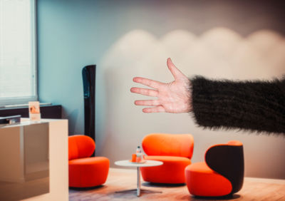 Close-up of woman hand on table at home