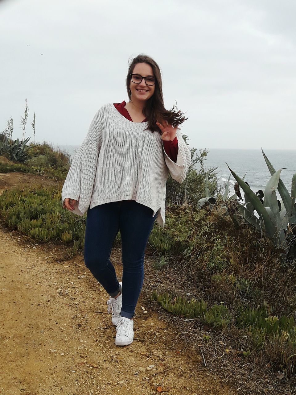 real people, young adult, young women, full length, casual clothing, one person, leisure activity, lifestyles, front view, standing, beautiful woman, nature, posing, outdoors, field, day, smiling, happiness, sky, portrait